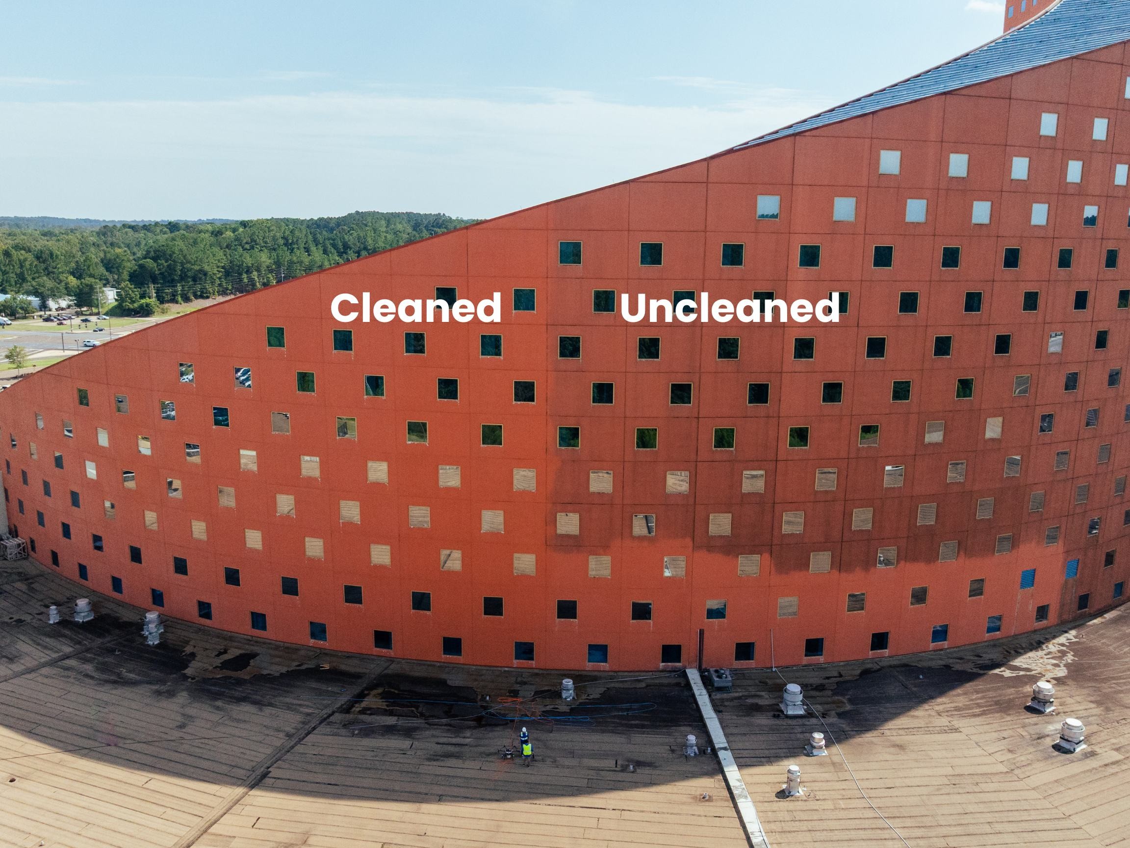 Split comparison of the Pearl River Resort tower facade showing the cleaned section on the left and uncleaned, streaked section on the right